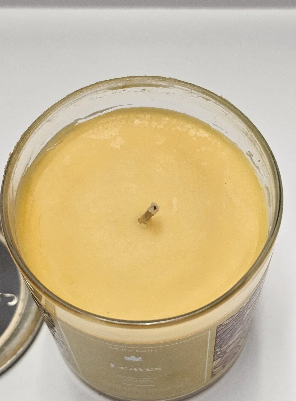 Bath & Body Works White Barn Leaves scented 8 Oz candle New